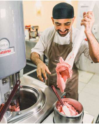 Gelato maker making gelato