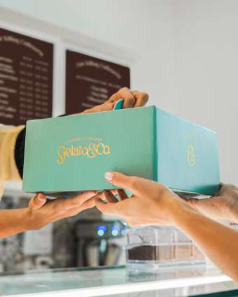 Handing over a cake box